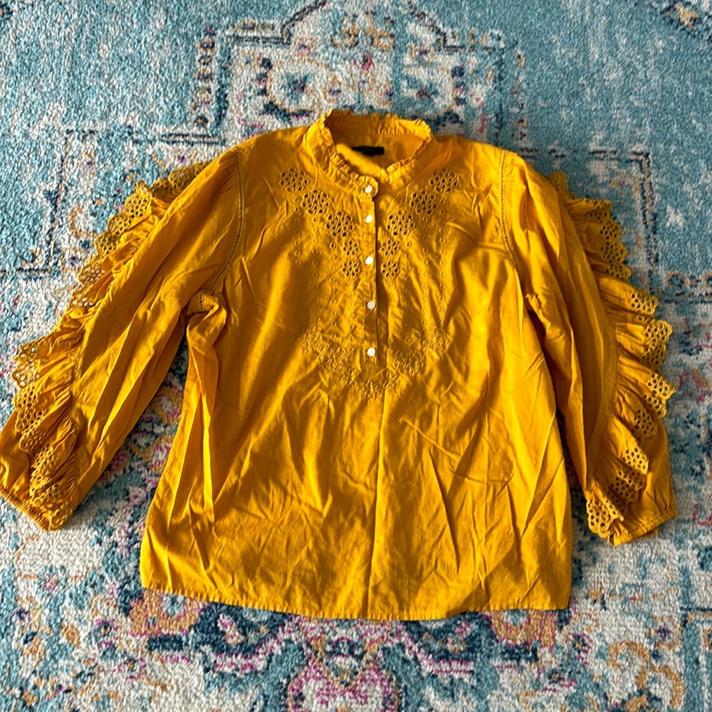 Ruffle-sleeve top with embroidered eyelet